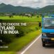Ashok Leyland Bada Dost truck driving on highway with green fields and hills in the background in India