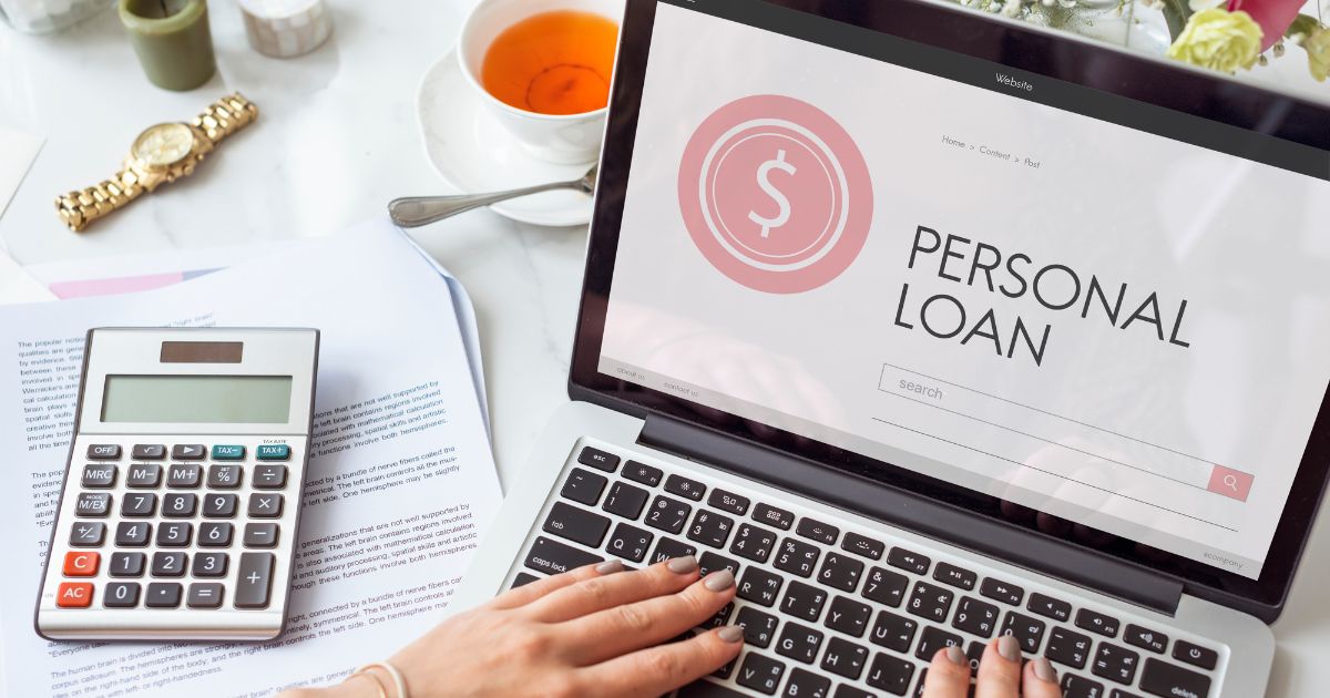 Laptop screen showing personal loan details, calculator and documents for vehicle finance planning