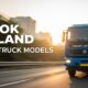 Blue Ashok Leyland 4-tyre truck model driving on highway, built for reliable transport solutions.